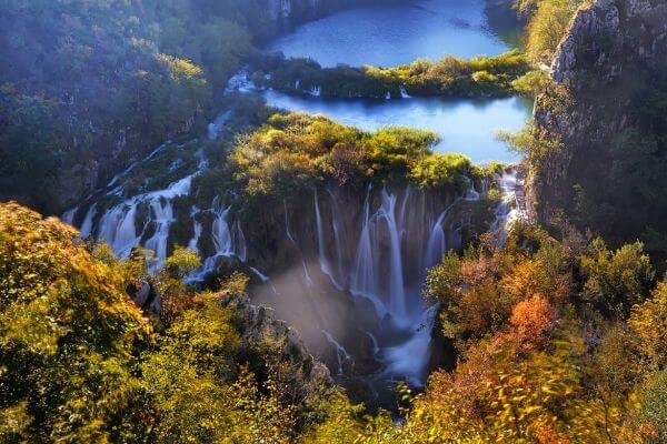 Plitvice Lakes National Park with turquoise waters and cascading waterfalls surrounded by lush greenery